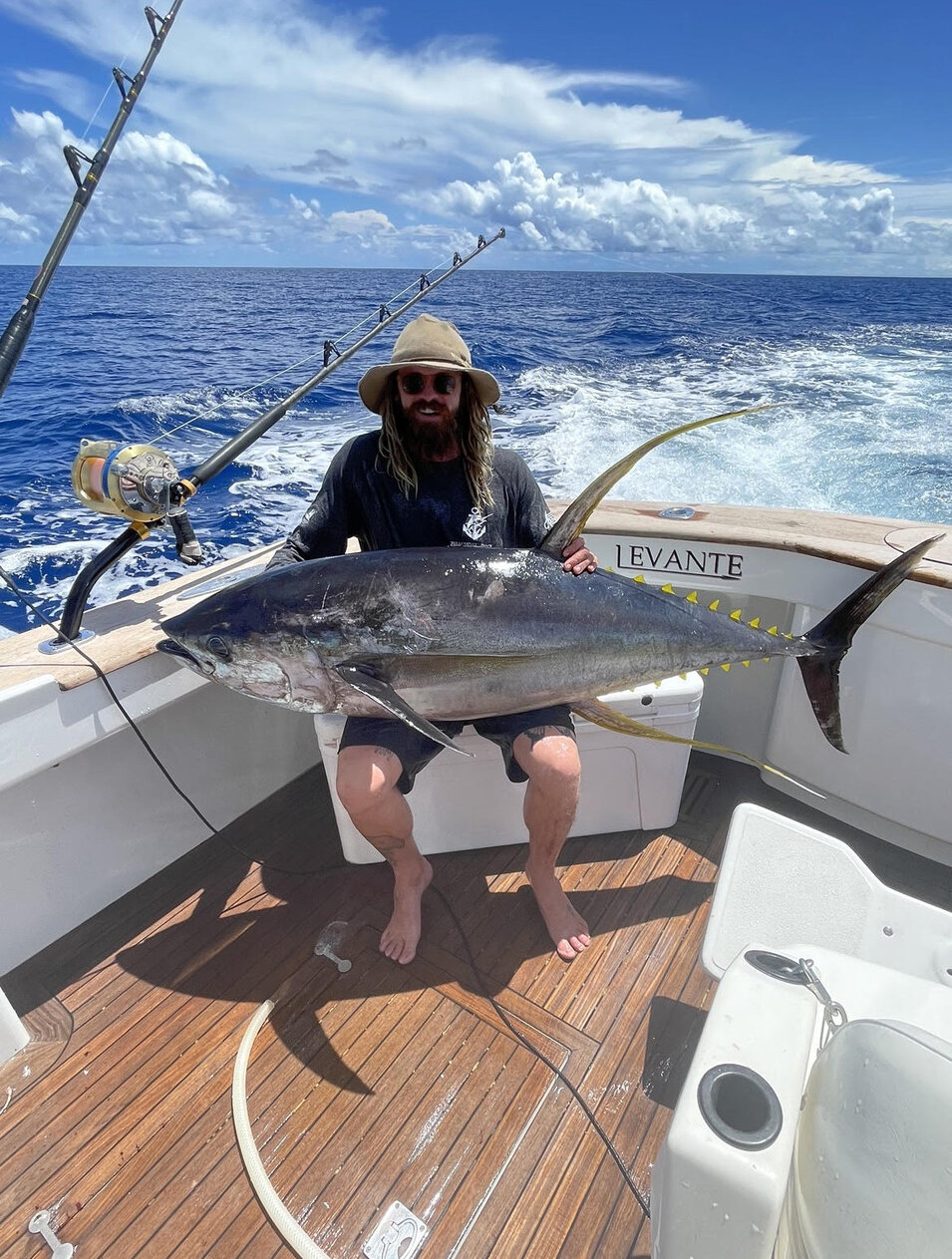 Angler showing off his freshly caught Yellowin tuna