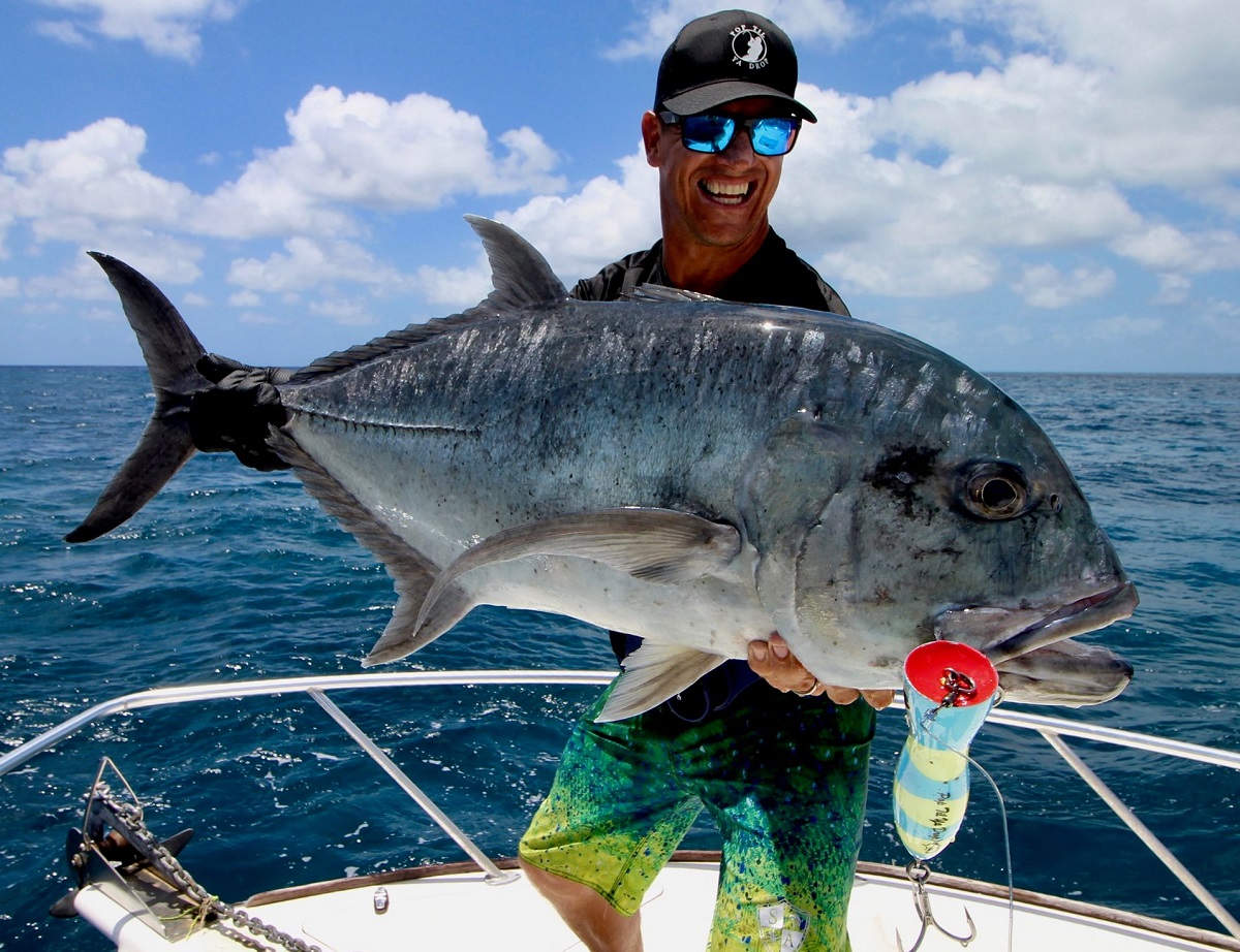 Game Angler presenting a giant trevally during reef popper fishing